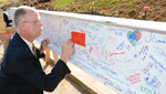 commissioner-butch-harris-signs-beam-DSC_0516-boxed.gif